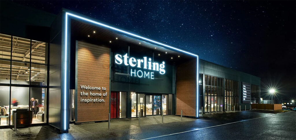 Sterling Home store exterior lit at night